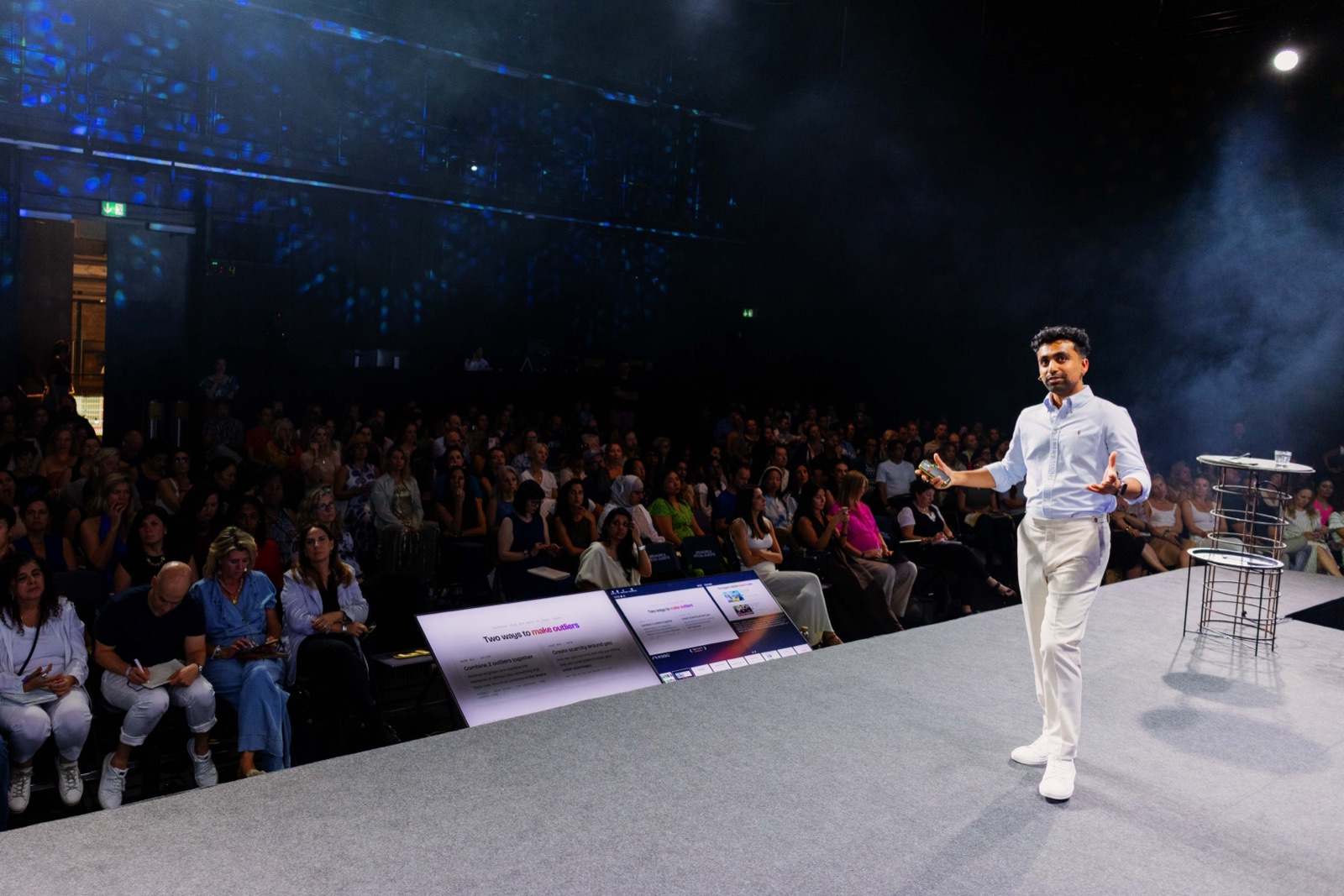 Saf on the runway stage at Mindvalley University, with the audience alongside him.
