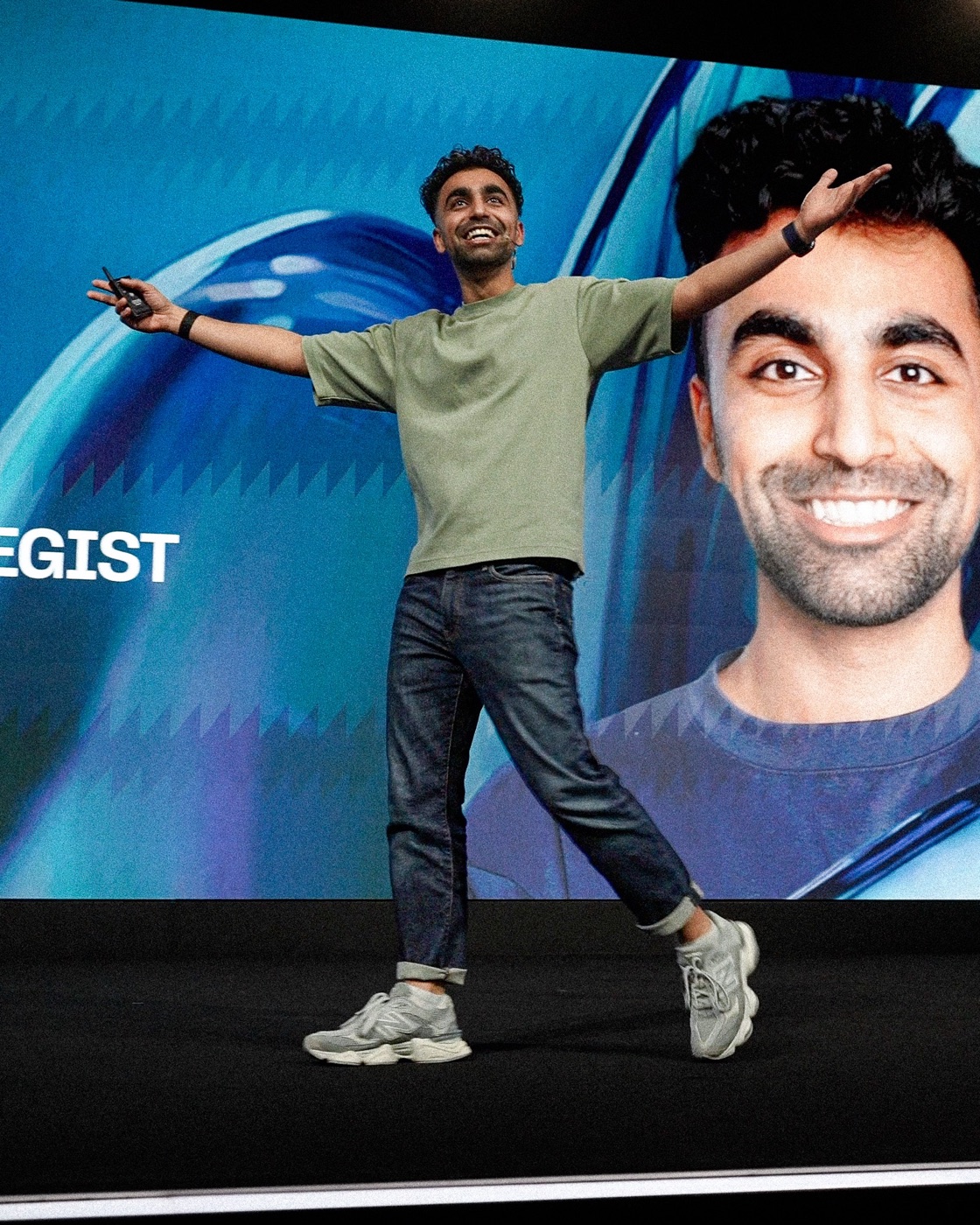 Saf on the main stage at the 1 Billion Followers Summit 2026 in Dubai, arms wide, in front of a screen reading YouTube Strategist.